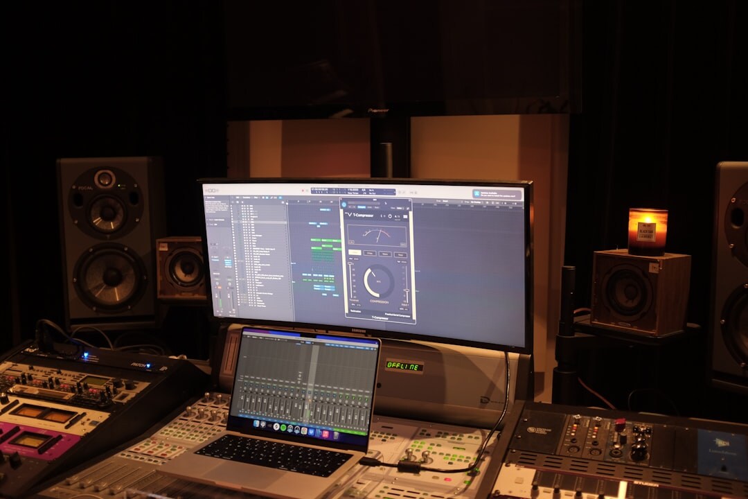 TV broadcast control room with multiple monitors and mixing panels